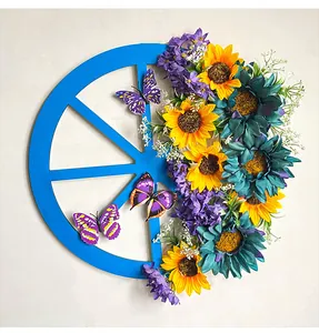 Detailed view of the vibrant blue sunflower wagon wheel wreath for door decoration.