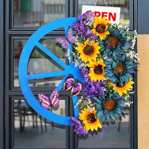 Decorative blue wagon wheel wreath with yellow sunflowers and purple butterflies for doors