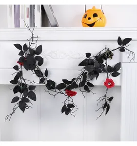 Detailed view of black Halloween vine garland with red roses and spooky eyeball accents