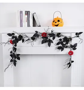 Black Halloween vine with roses and leaves hanging on a white fireplace mantel.