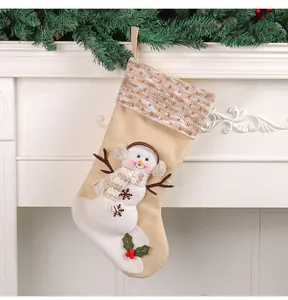 Detailed view of burlap Christmas stocking featuring 3D plush snowman and striped cuff
