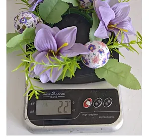 A detailed view of a handmade Easter egg floral wreath weighing exactly 22 grams