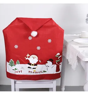 Close-up of festive red non-woven chair cover with cute Santa Claus and snowman prints