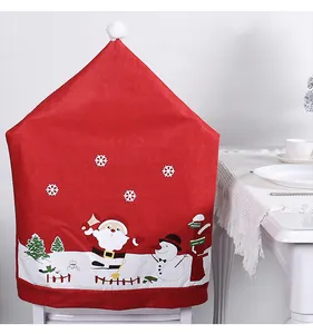 Festive red Christmas chair cover detail with Santa Claus and snowman cartoon prints