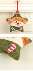 Close-up of plush snowman star Christmas ornament showing green burlap and candy cane detail