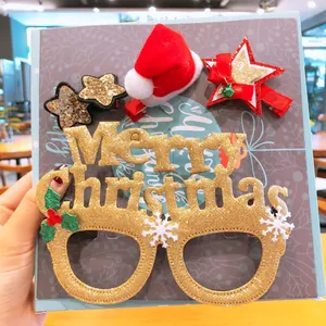 Λεπτομερής προβολή γυαλιών Merry Christmas με γκλίτερ και εορταστικού σετ κλιπ