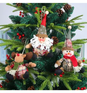 Plaid Christmas plush ornaments featuring Santa, Reindeer, and Snowman on a festive tree.