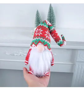 Knitted Christmas gnome doll with long snowflake hat, festive holiday tabletop decoration