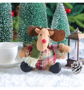 Close-up detail of a cute plaid reindeer plush doll for festive Christmas decor