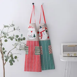 Festive Christmas linen aprons featuring Santa and Snowman motifs for holiday cooking