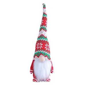 Handmade Christmas gnome plush with tall knitted hat and snowflake patterns for decor