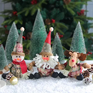 Three adorable plaid Christmas plush dolls including snowman, Santa gnome, and reindeer