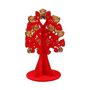 Traditional red wooden Chinese New Year money tree decoration with golden ingots