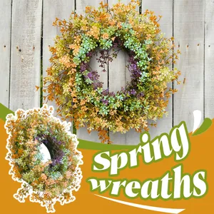 Vibrant spring wildflower wreath with yellow and purple daisies for home door decor.