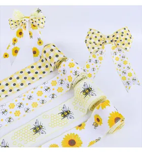 Close-up of faux burlap ribbons featuring bumblebee, sunflower, and honeycomb prints