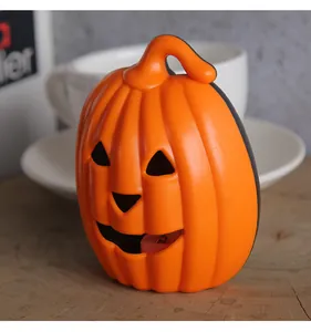 Close-up detail of a bright orange jack-o'-lantern light for Halloween party decor