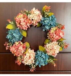 Detailed view of artificial blue and pink hydrangea wreath for elegant front door decor
