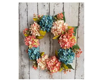 Macro view of realistic blue and pink hydrangea flowers on a decorative spring holiday wreath