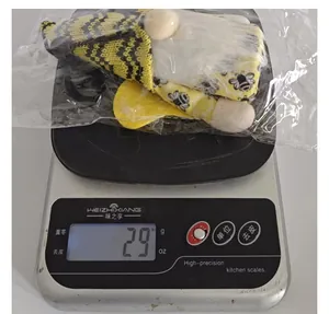 Weight measurement detail of Bumblebee gnome plush showing 29 grams on digital scale.