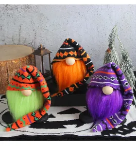 Detailed view of three Halloween gnomes with long knitted hats and colorful beards.