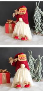 Close-up detail of festive Christmas gnome with red hat and Thankful Blessed embroidery