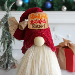 Cute Christmas gnome plush doll featuring red hat and thankful embroidery for desktop