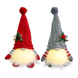 Pair of LED glowing Christmas gnomes with knit hats for festive holiday home decor.