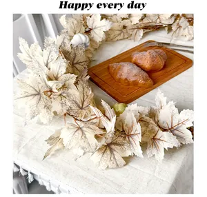 Realistic artificial cream maple leaf vine for autumn Thanksgiving home decoration.