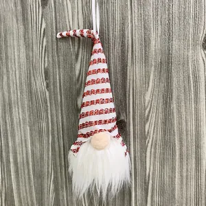 Detailed view of a sequined red and white striped Christmas gnome ornament with white beard.