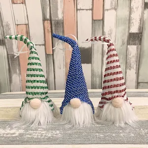 Set of three Nordic Christmas gnomes with striped and sequin hats for home decor