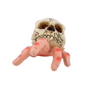 Realistic Halloween skull held by zombie hand resin garden ornament horror decor