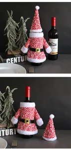 Detailed view of knitted Santa outfit wine bottle cover and matching pointed hat