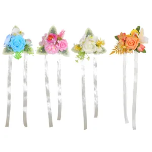 Brautjungfern-Handgelenks-Corsagen mit künstlichen Rosen und langen weißen Bändern