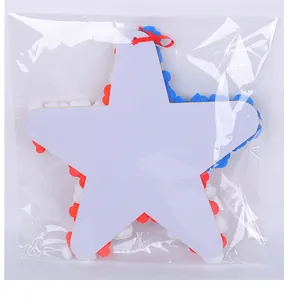 Back view of patriotic red white blue PU flower star door hanging in plastic packaging