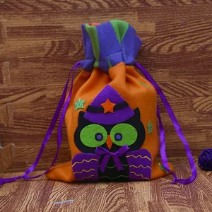 Halloween owl drawstring gift bag for candy, made of vibrant orange and purple felt fabric