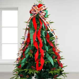Dekorative Weihnachtsschleife für die Baumspitze mit Nussknacker-Motiv und Bändern