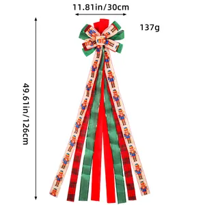 Übergroße Christbaumspitze Schleife mit Nussknacker-Motiv und langen Festbändern