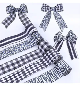 Detail showing various patterns of decorative ribbons and handmade bows for DIY crafts.