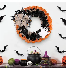 Festive Halloween ghost wreath with orange and black ruffles and burlap bow decoration