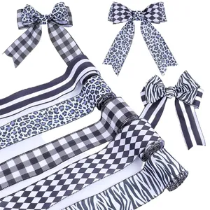 Assorted black and white patterned ribbons with leopard, stripe, and checkerboard prints