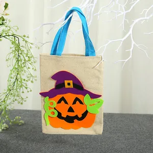 Sacchetto per dolci in iuta di Halloween con applicazione zucca e manici in blu acceso
