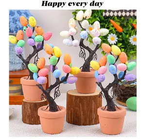 Vibrant speckled Easter egg trees in terracotta pots for festive home decoration