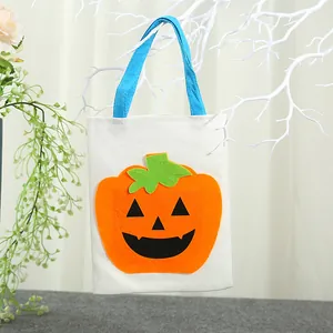 Borsa di Halloween in tela con motivo a zucca e manici blu per regali.