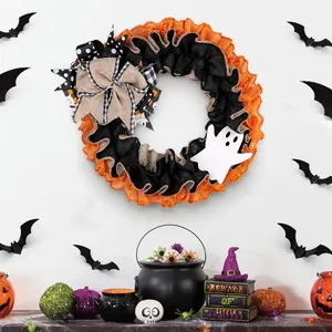 Festive Halloween ghost wreath with burlap bow and mesh ruffles for front door decor