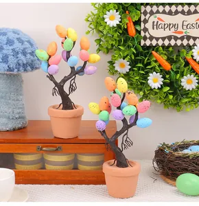 Detailed view of colorful spotted Easter egg trees in terracotta pots for decor