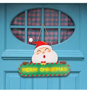 Illuminated Santa Claus wooden door plaque with a Merry Christmas greeting for home
