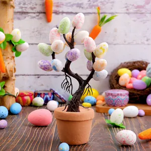 Decorative Easter egg tree potted plant with colorful speckled eggs for home decor