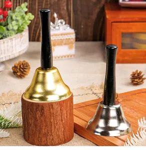 Set of gold and silver decorative Christmas handbells with elegant black wooden handles