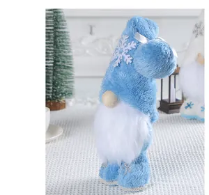 Seitenansicht eines blauen Plüsch-Weihnachtswichtels mit weißer Schneeflocke und Bart