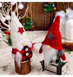 Charming set of two Christmas gnomes with knitted star hats in a cozy winter scene.
